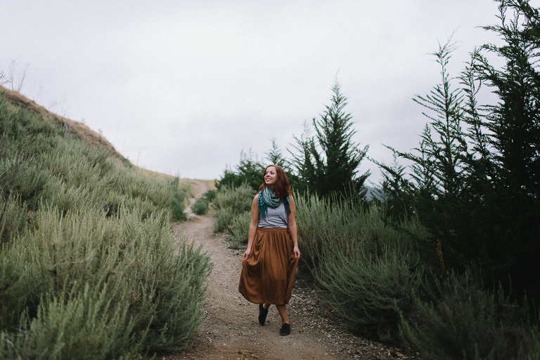 woman walking at irish hills in san luis obispo, standing in trees